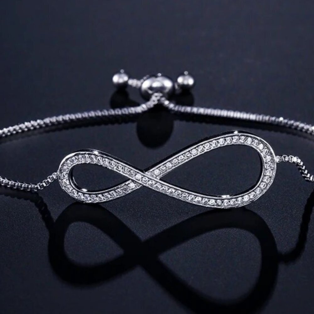 Jewelry bracelet infinity style white gold tone with stones sparkly adjustable